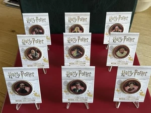 (S6) 9 RARE HARRY POTTER MEDALS COINS IN CARD LUCIUS MALFOY SCABIOR DURSLEYS ETC - Picture 1 of 11