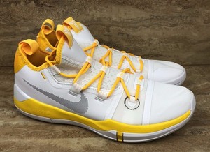 yellow and white basketball shoes