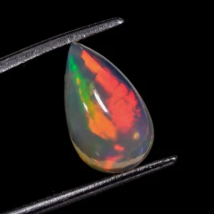 Pietra preziosa cabochon pera opale etiope colore naturale fuoco 1,85 CT 7x12x4 mm DT71 - Foto 1 di 7