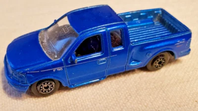 Welly Blue Ford F150 Flare Side Super Cab Die Cast Truck - Image 1 of 4