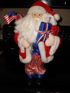 19" PATRIOTIC RED/WHITE/BLUE FREE STANDING SANTA W/ BAG, GIFTS & AMERICAN FLAG - Picture 1 of 10
