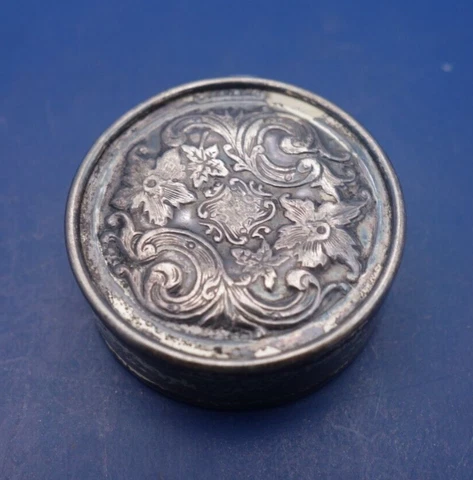 Antique sterling silver tailors tape measure w/ flowers and foilage Cover