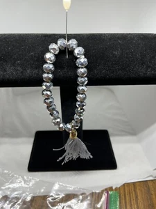 Hematite Stretch Bracelet With A Grey Tassel - Picture 1 of 4