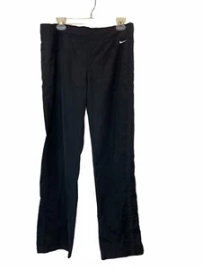 Pantalones de chándal Nike para mujer talla 12-14 dobladillos divididos bordados bolsillos Swoosh, negros - Imagen 1 de 8