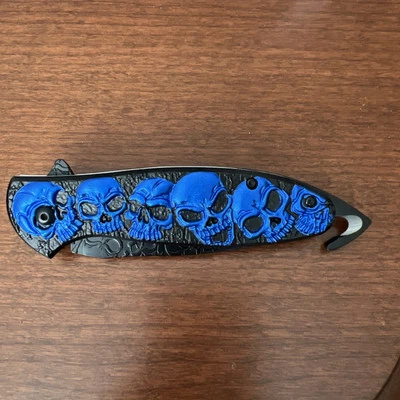 Folding Knife. Blue Skulls.  Seatbelt Cutter.  Spring Assist Opening. 3.5” Blade - Image 1 of 4