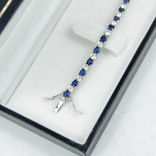 White Gold Finish Created Diamond Blue Sapphire Round Cut Tennis Bracelet - Image 1 of 4