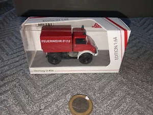 ZH579 Schuco 1:64 Mercedes Unimog U 406 Feuerwehr 112 Made in China Mit Ovp - Bild 1 von 9