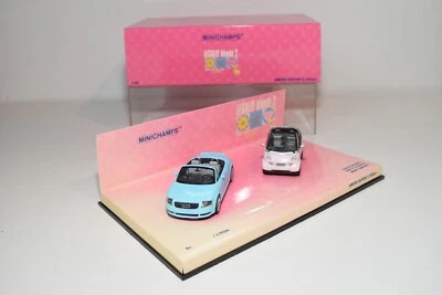 A56 1:43 MINICHAMPS 402 173900 LEGALMENTE BIONDA 2 SMART CABRIO AUDI TT CABRI... - Immagine 1 di 4