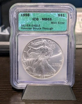 1998 Silver Eagle Mint Error Reverse Struck Through MS68 - Image 1 of 3