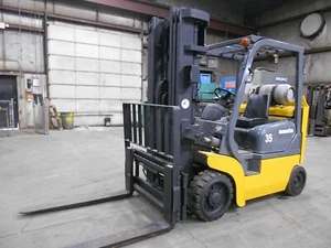 2003 Komatsu FG35BCS-7H, 7,000#, 7000# Cushion Tired Forklift w/3 Stage, SS - Picture 1 of 12