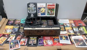Atari 2600 Konvolut Tele-Games Center, 20 Spiele, Joysticks Paddel, Schnüre, Handbücher - Bild 1 von 8