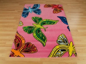 Alfombra rosa mariposa multicolor funky moderna para niños bebé zona de juego M-L 30% de descuento - Imagen 1 de 3
