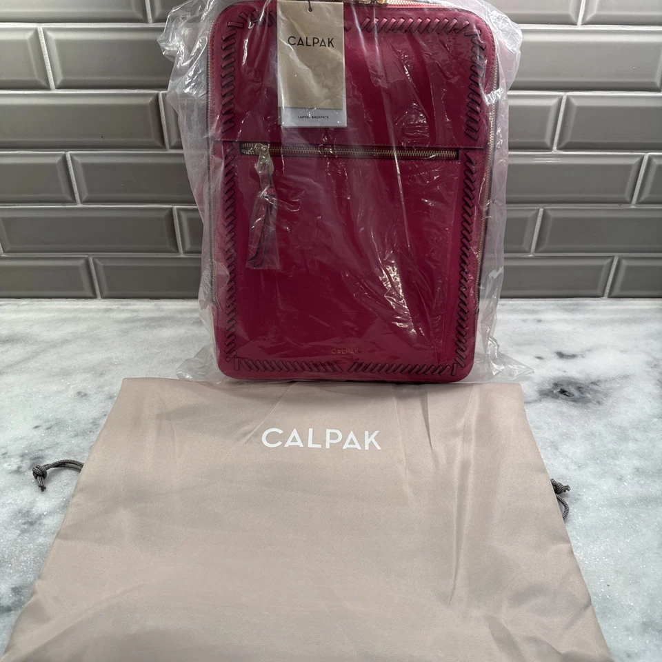 CALPAK Kaya 17 Inch Laptop Backpack in Dragonfruit Pink Stylish Vegan Leather  - Image 1 of 4