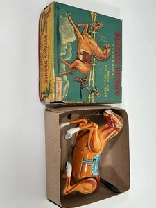 Vintage Weißblech Uhrwerk Mechanisch Bucking Bronco, Daiya, Japan. EXiB - Bild 1 von 9