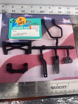 Soporte trasero MUGEN SEIKI T0130: MTX3 nuevo en paquete enviado a EE. UU. Foto 1 de 4