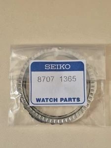 Brand New Seiko Silver/Black Bezel - Part No. 87071365 - Fits  model V172-0AT0 - Picture 1 of 3