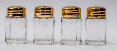 4 saleros y pimenteros Cartier con tapas de plata de ley - lavados en oro Foto 1 de 4