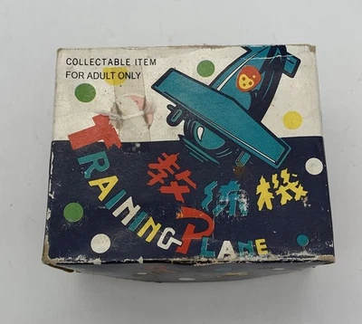 Brinquedo de corda “avião de treinamento” de estanho – reprodução 4” para exibição não funcionando - Imagem 1 de 4
