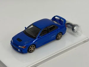 1/64 Motorhelix Mitsubishi Lancer Evolution IV in Blue 64-052 - Picture 1 of 10
