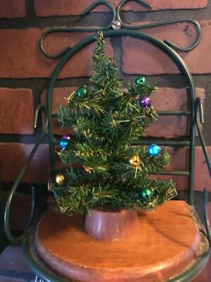 Vintage Christmas tree in Green Decorated on plastic base 7 inches tall - Image 1 of 4
