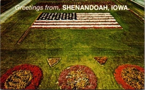 Greetings from SHENANDOAH, Iowa IA FLORAL FLAG Postcard - Picture 1 of 2