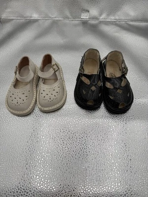 Doble par de mocasines Penny blancos y negros para niños años 60 Foto 1 de 3