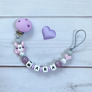 Catenella Ciuccio Fiocco Nuckelkette con Nome Lilla Rosa Grigio Silicone - Bild 1 von 1