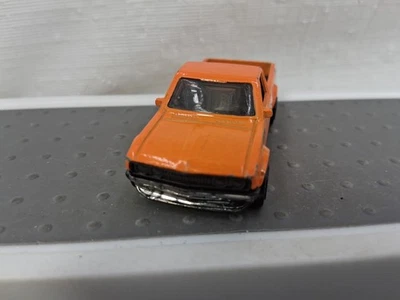Camioneta todoterreno Datsun 620 Hot Wheels 2013 naranja fundido a presión Foto 1 de 4