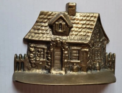 Tope de puerta de latón de casa rústica Foto 1 de 3