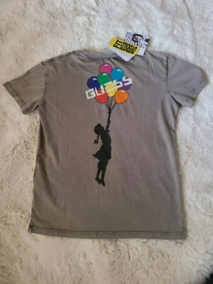 Camisa Globo Guess Brandalised Graffiti de Banksy Niñas Talla 7 Foto 1 de 4