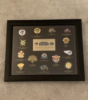 Toronto Blue Jays Historical Collection Of 12 Vintage Pins *Framed In Glass* - Image 1 of 4