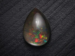 Cabujón de ópalo negro etíope de 10,05 quilates 14X8X3 mm forma de pera Welo ópalo de fuego - Imagen 1 de 3