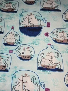 100% Cotton Kraken Ship In A Bottle Pirate Ocean Julia Green Blue Fabric FQ - Picture 1 of 2
