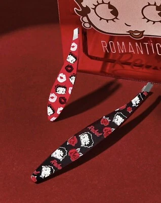 Juego de 2 pinzas para cejas Betty Boop rojas y negras Foto 1 de 2