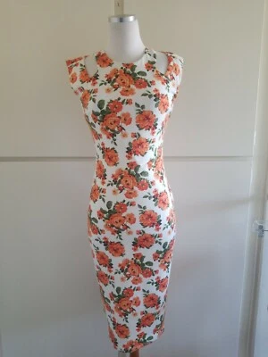 Vestido Va Va Voom Marfil/Naranja/Verde Floral Tejido. Recortes de hombro, M, usados en excelente estado Foto 1 de 4