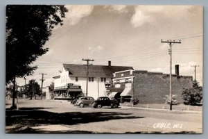 RPPC Postkarte 40er Jahre Straßenszene Kabel, WIS. Eisenwaren, Drogerie, Coca Cola - Bild 1 von 2