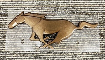 OEM 2024-2025 MUSTANG PONY EMBLEM BRONZE PR3Z-6342528-G - Image 1 of 2