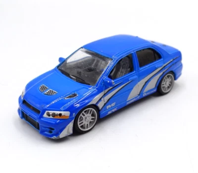Fast & Furious Mitsubishi Lancer Evolution VII Blue 1:64 ERTL Racing Champions - Image 1 of 4