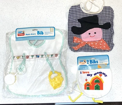 Baberos de bebé vintage 4 NOS 3 Playskool y 1 vaquero vinilo y rizo juguetes a presión Foto 1 de 2