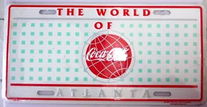 COCA-COLA© -PLAQUE IMMATRICULATION THE WORLD OF ATLANTA NEUF BLISTER 1995 N°2704 - Imagen 1 de 2