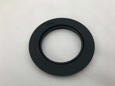 Lee Filters 67mm adapter ring and white storage lens cap. - Image 1 of 3