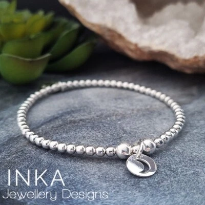 Pulsera apilable de plata de ley 925 con cuentas elásticas con encanto de moneda de luna INKA Foto 1 de 4
