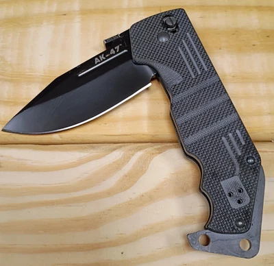 Cuchillo plegable Cold Steel AK-47 • AUS-8A Taiwan • Mango G10 • Bloqueo Tri-Ad Foto 1 de 4