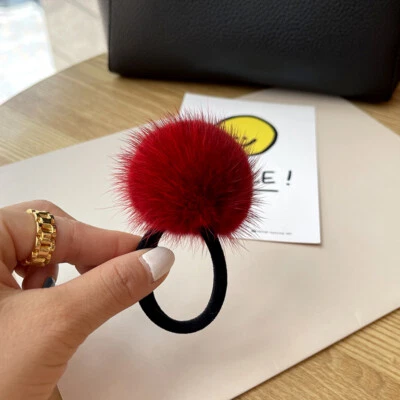 Banda para la cabeza de piel de visón real para mujer cuerda cola de caballo banda para la cabeza con bola de pompón Foto 1 de 4