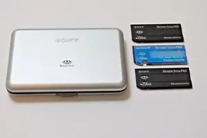 2 Sony 1 Sandisk Mem Stick Pro 256 mb Magic Gate ,Sony Carry case Free Ship - Picture 1 of 3