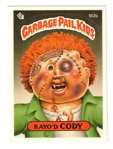 1986 Topps Garbage Pail Kids Series 3 Kayo'd Cody #102 casi nuevo de colección humor grueso - Imagen 1 de 2
