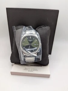 Reloj pulsera informal de cuarzo con esfera redonda negra plateada de 12 horas Tissot para hombre - Imagen 1 de 13