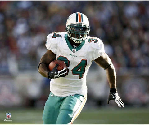 Ricky Williams Miami Dolphins Unsigned White Jersey Running Photograph Cover