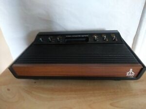 Atari 2600 Console Only 6 Switch Wood Grain Front parts or repair No Av Cable