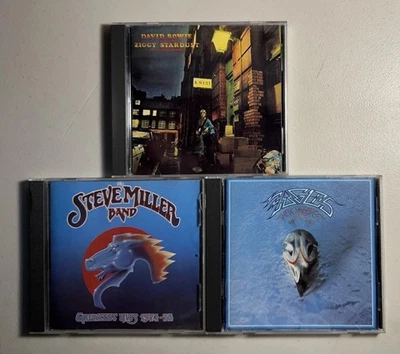 Classic Rock 3 CD Lot: DAVID BOWIE Ziggy Stardust, STEVE MILLER, EAGLES Greatest Foto 1 de 4